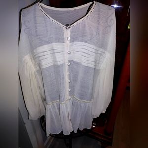 Stunning silk top with a sequin at the top